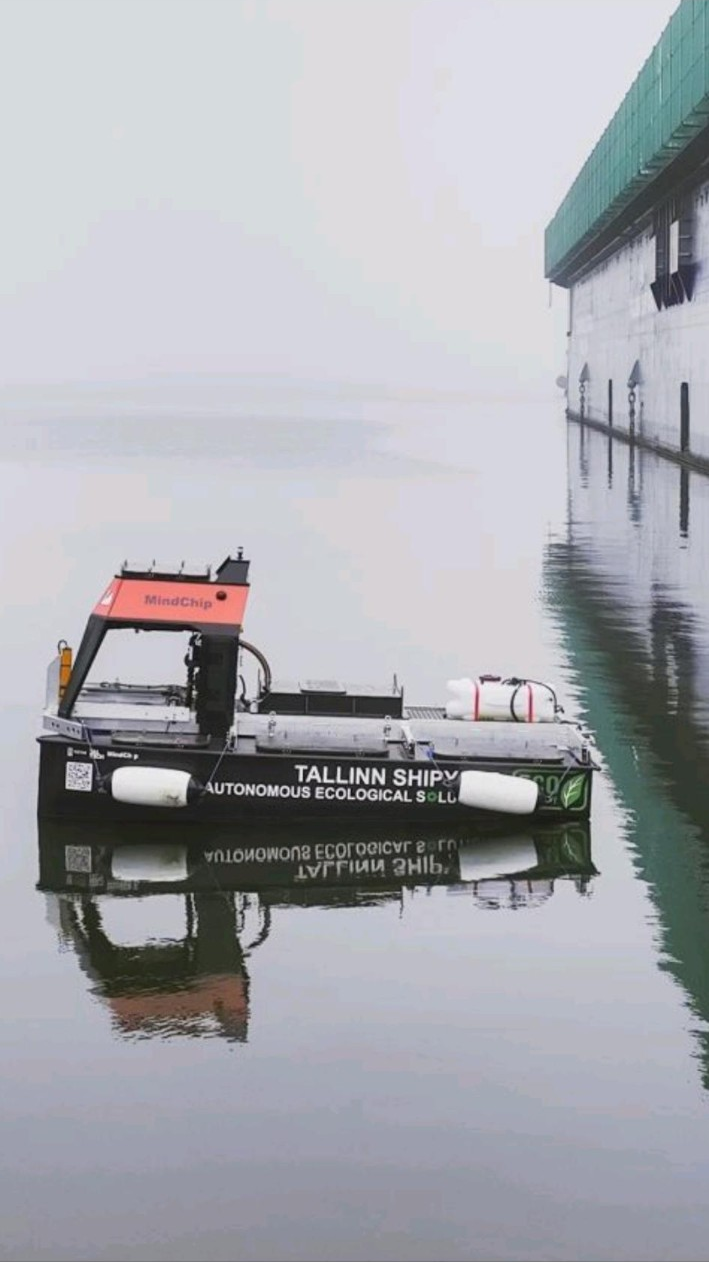 Black autonomous vessel floating in a Tallinn harbour in 2025.