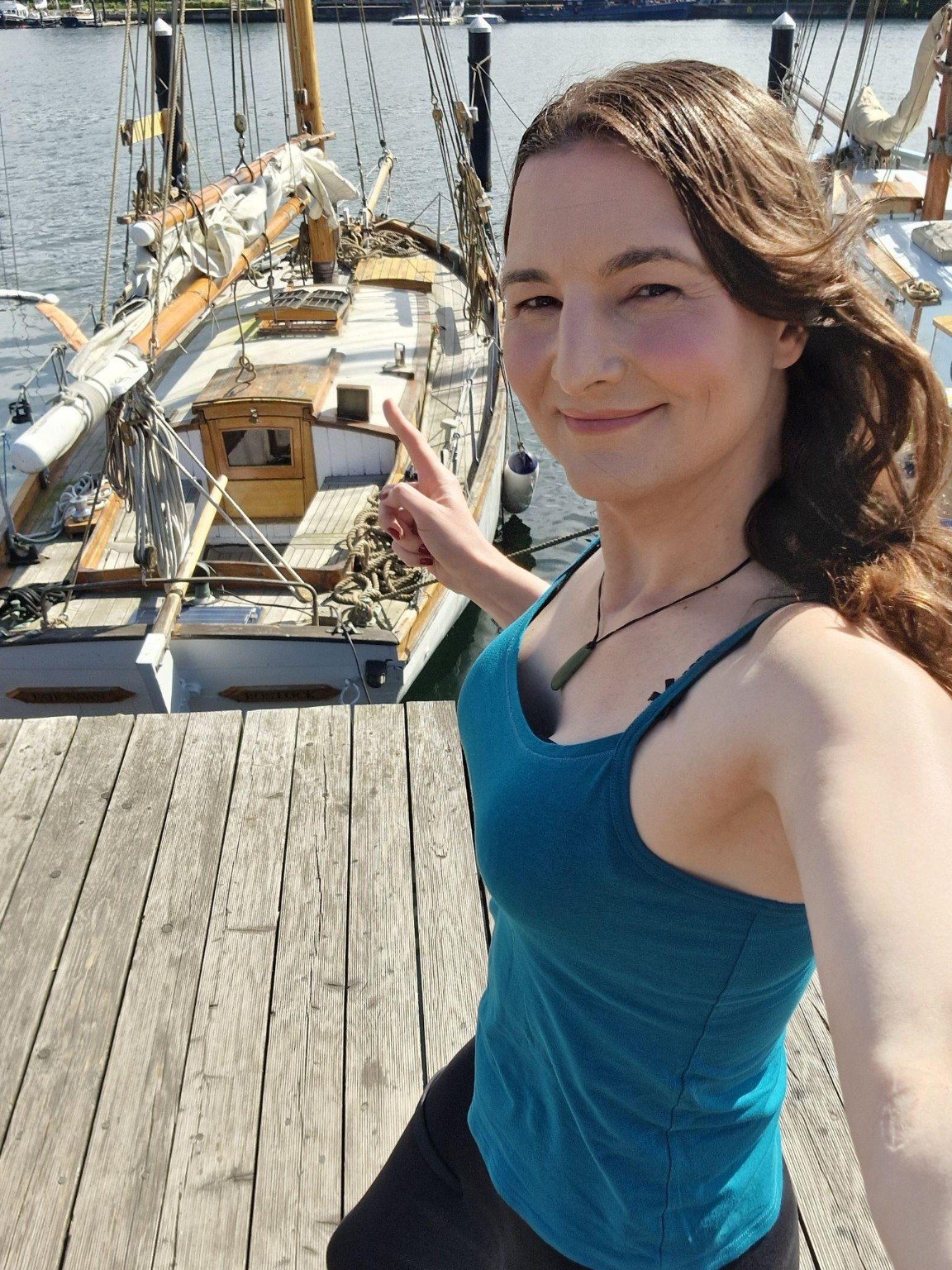 Diana S. Engelhard aboard a sailing yacht at a marina.